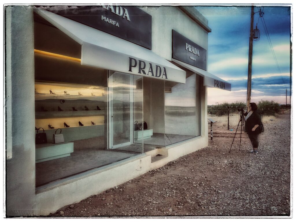 Photographer KC Hulsman shooting at Prada Marfa. Photo courtesy Mary Ann Glass.